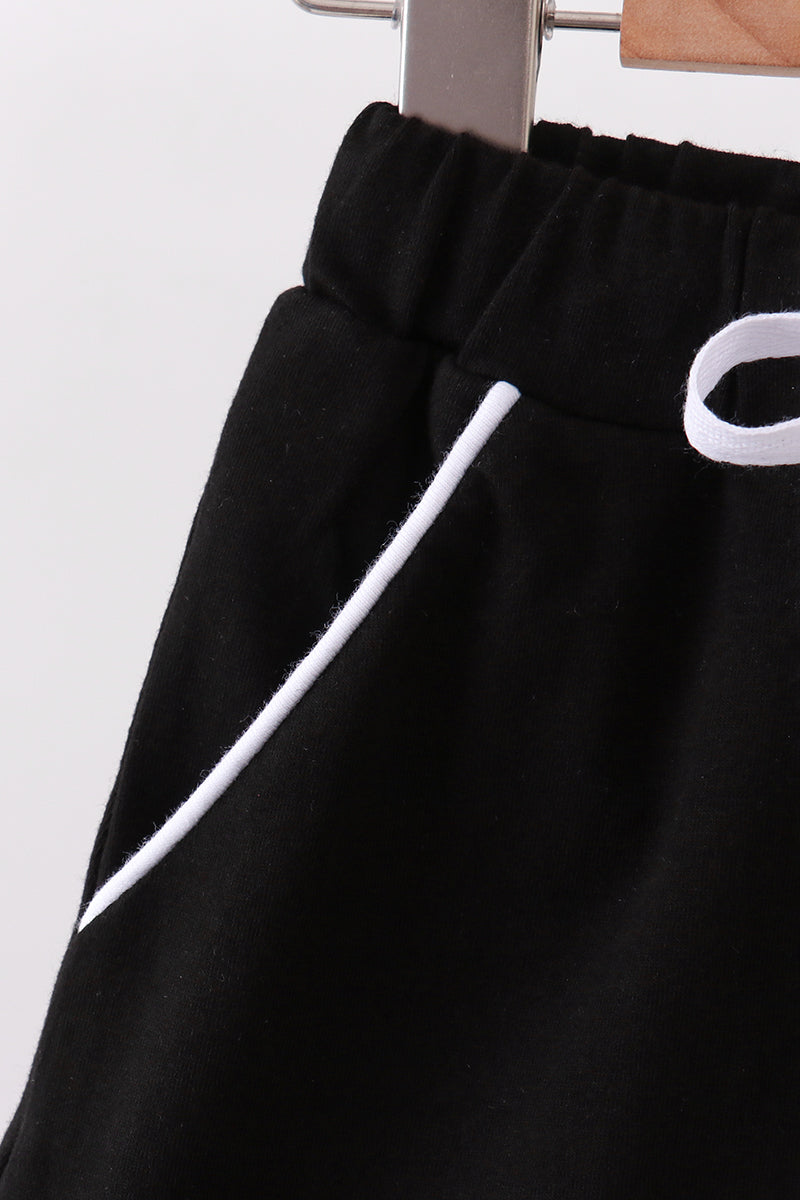 Black scallop hem bow skort